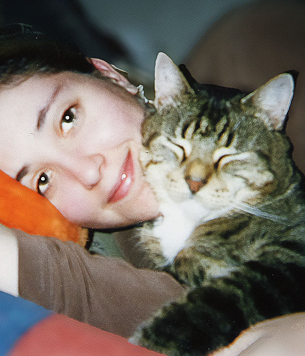 Mel Hyland holding her beloved cat Oakley-Bean in an early photo.